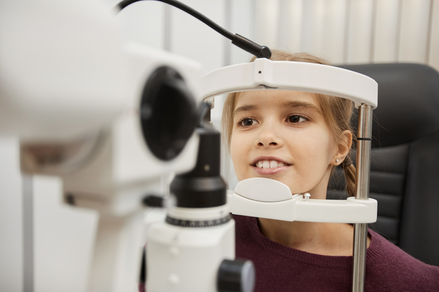 Portrait of young girl at eye exam